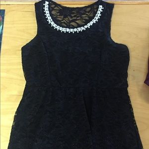 Women’s little black, lace dress.